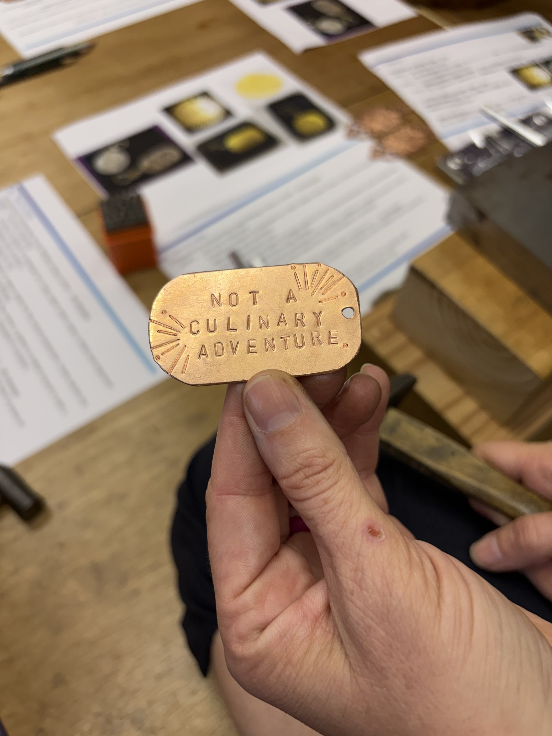 Close-up of a finished stamped keychain